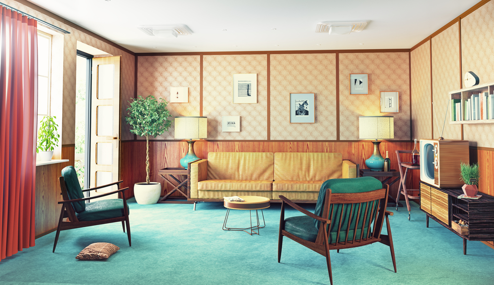 a living room with a turquoise carpet and retro design