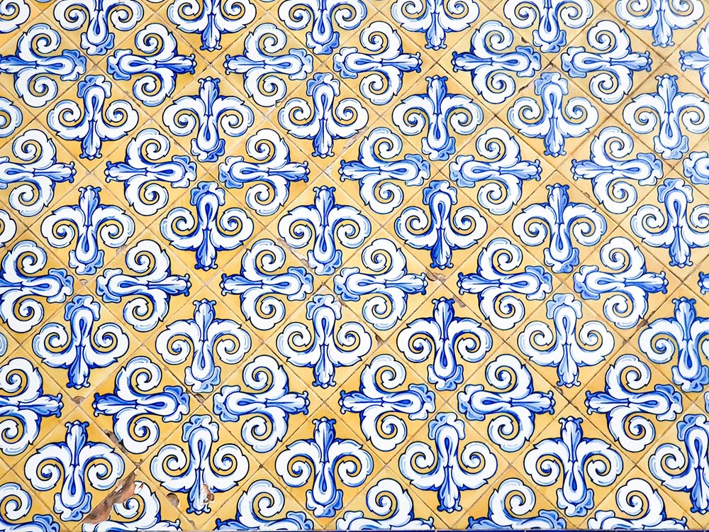 Birds-eye view of yellow tile with a blue and white design