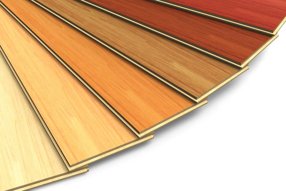 a variety of different laminate flooring boards fanned out to show off different colors and styles
