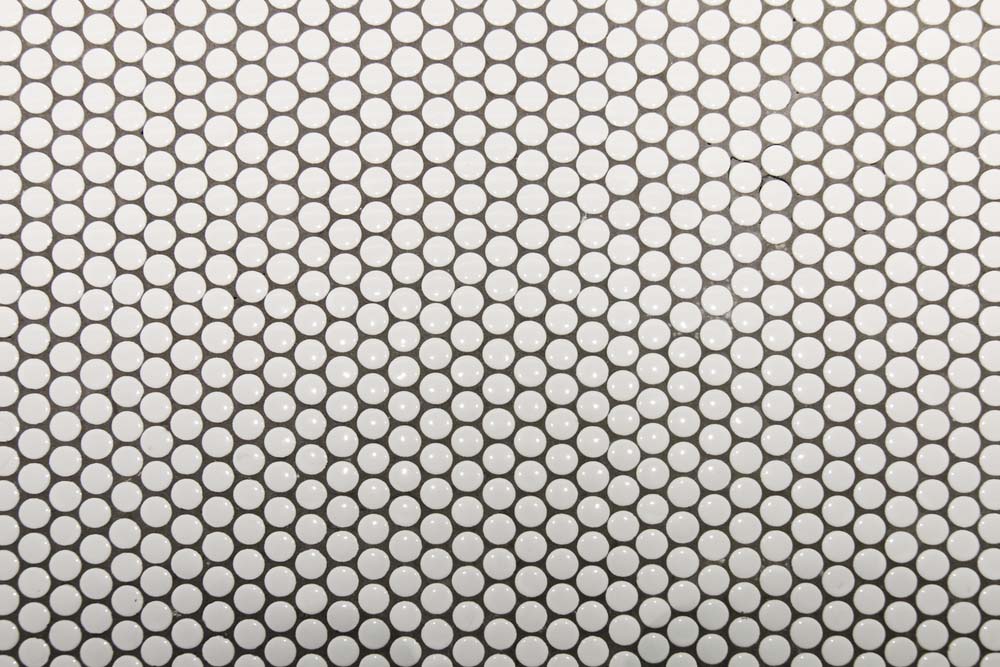An image of a white penny tile, straight-on. 