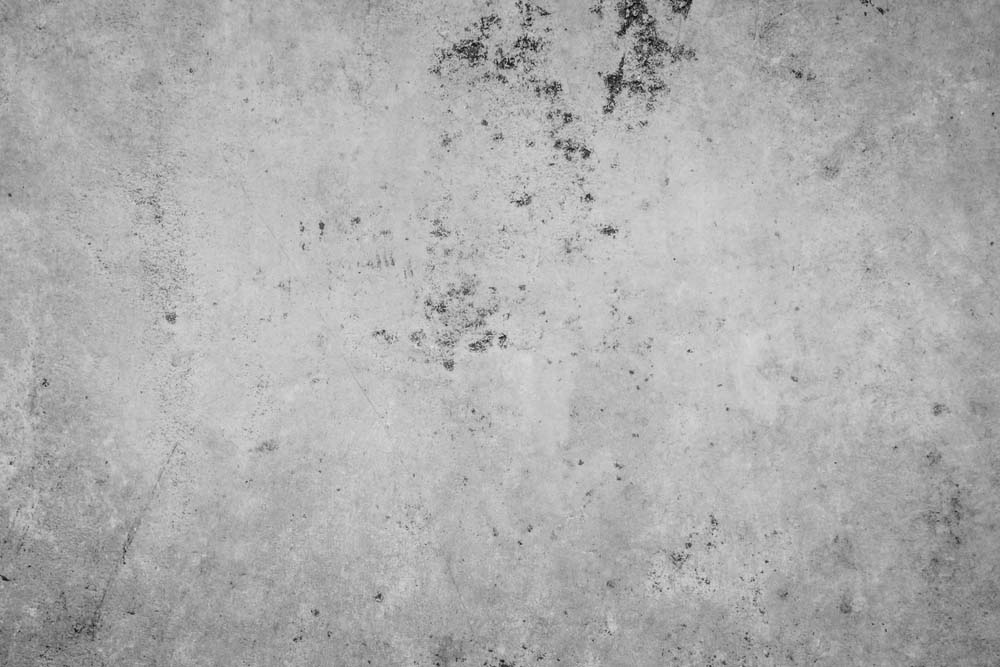 Grey carpet with black spots.