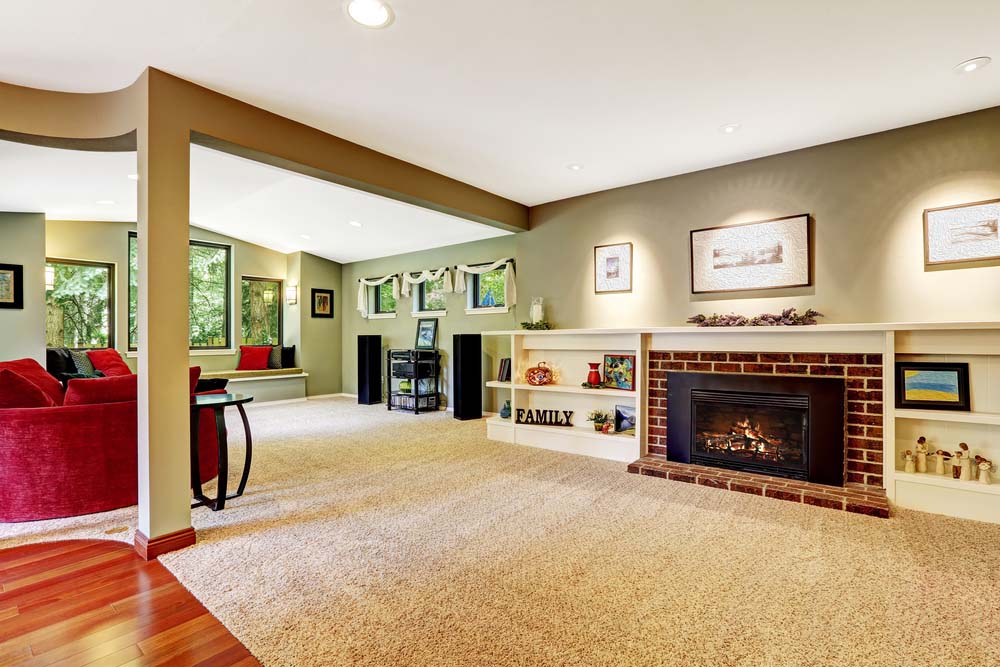 Living room in light green color with brown soft carpet floor.