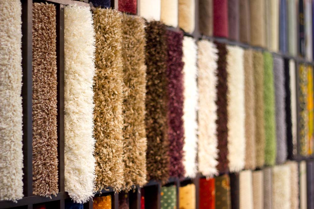 Stand with carpet samples in multiple colors.